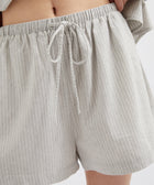Gray striped shorts with a drawstring on a white background